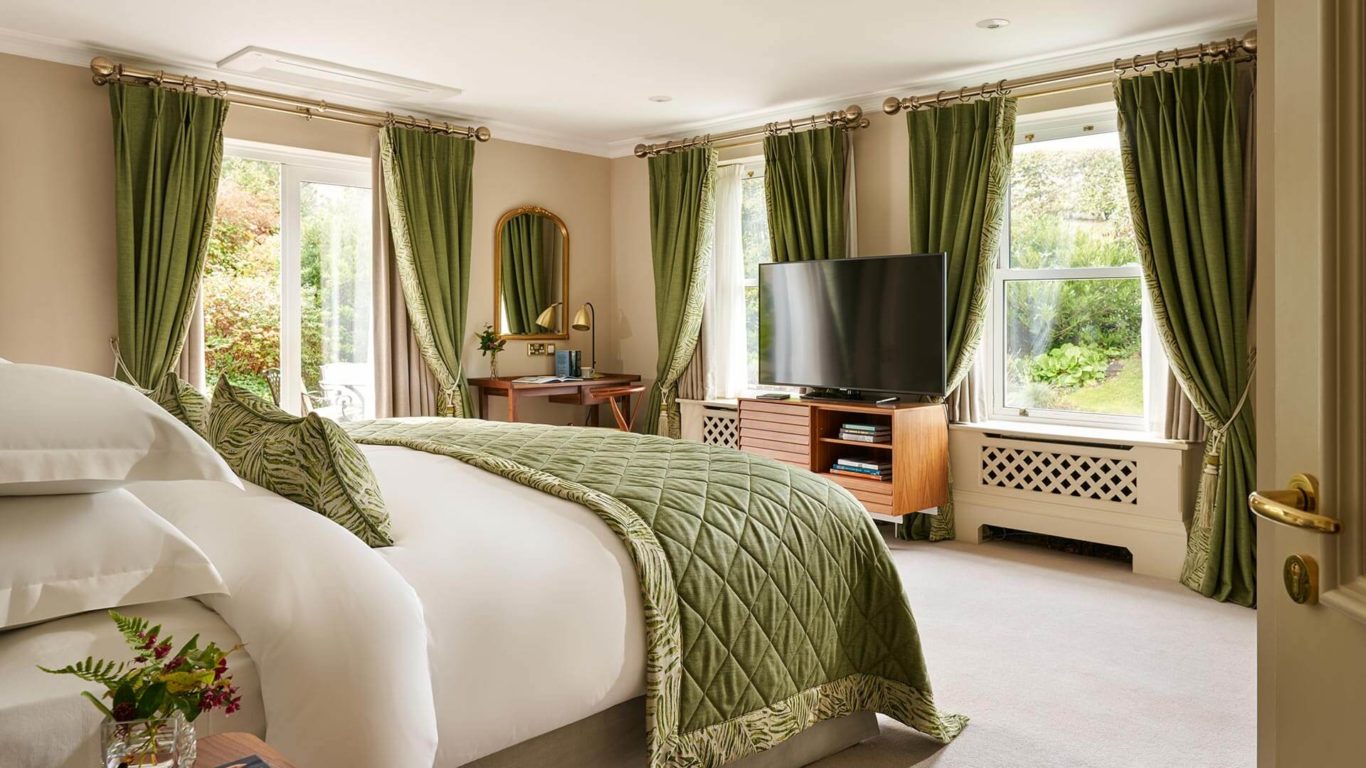 Bay View Suite Bedroom at Sheen Falls Lodge with green furnishings