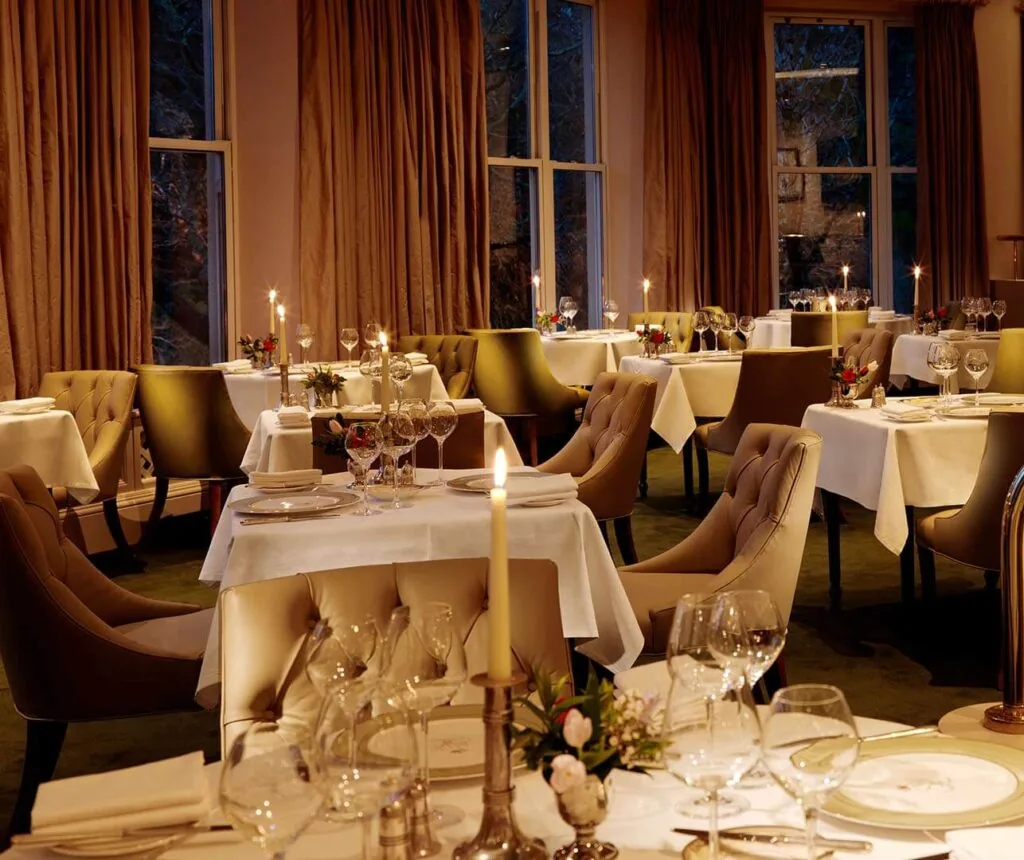 Image of chairs and tables in the dining room of Sheen Falls Lodge