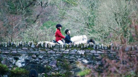 Two people horse-riding in Kenmare