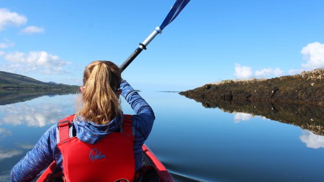 A Girl Kayaking in Kenmare Bay