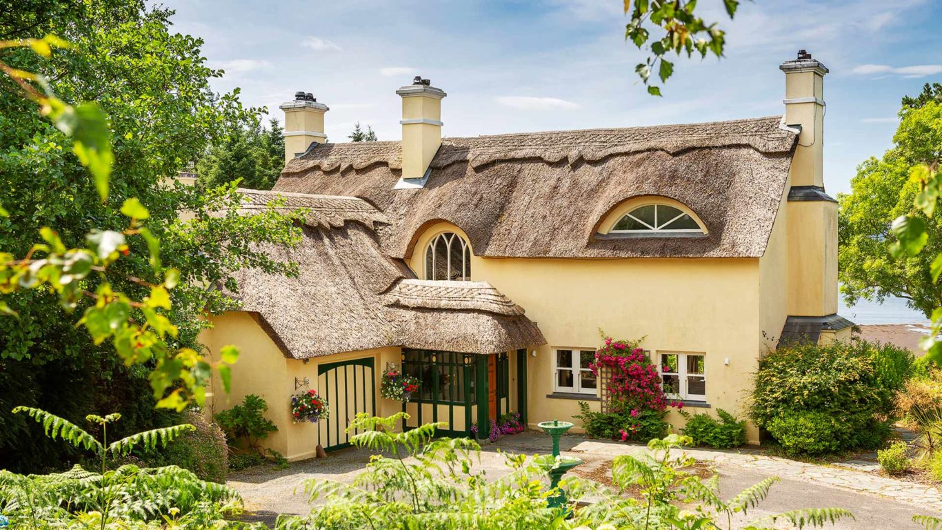 Thatched Yellow Cottage on Sheen Falls Lodge Estate