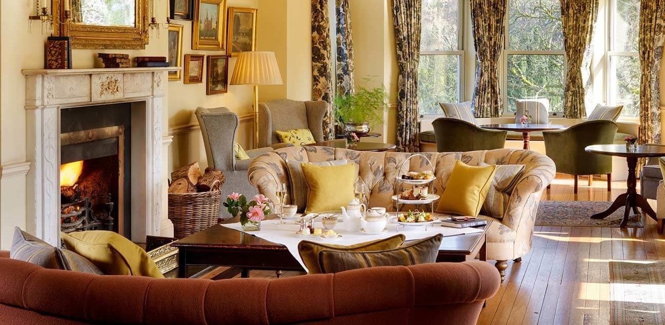 Bright lounge with furniture in Sheen Falls Lodge