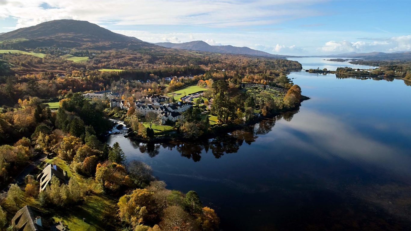 Aerial view above Sheen Falls Lodge of the mountains, water and trees