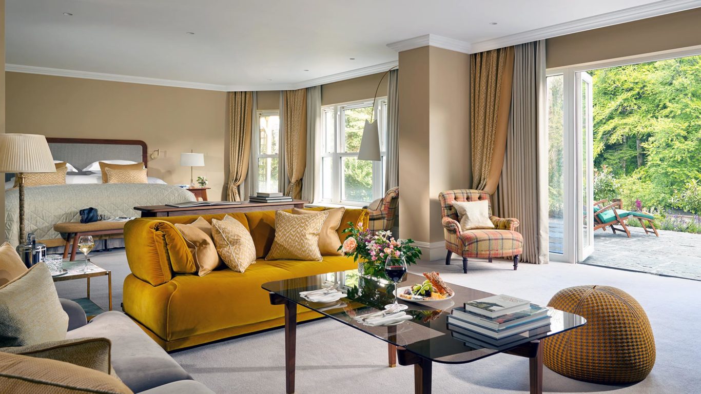 Bedroom in the Oscar Suite in Sheen Falls, view of living area furniture and bed