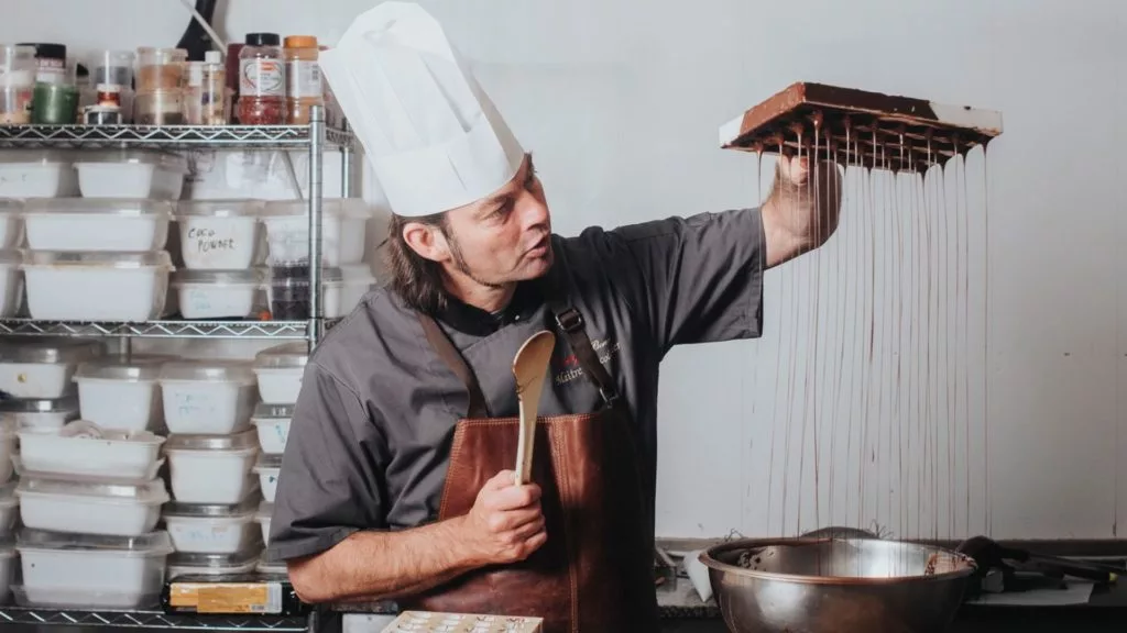 Lorge Chocolatier pouring chocolate
