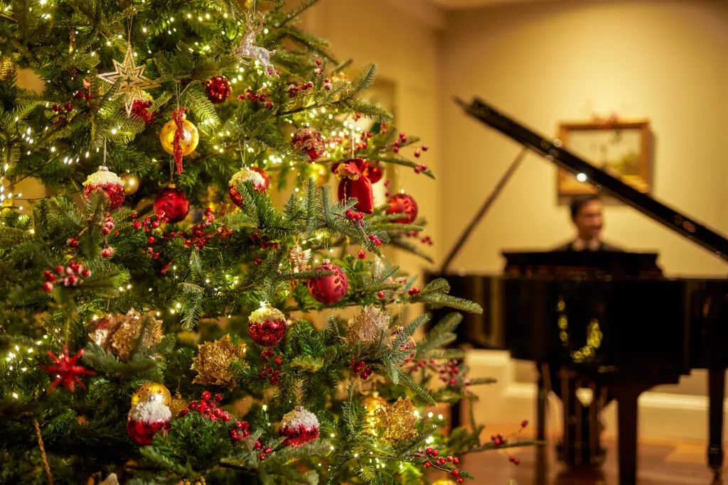 Grand piano and Christmas tree in Sheen Lounge