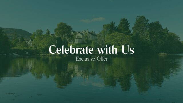 Large house surrounded by trees on a lake shore with the text