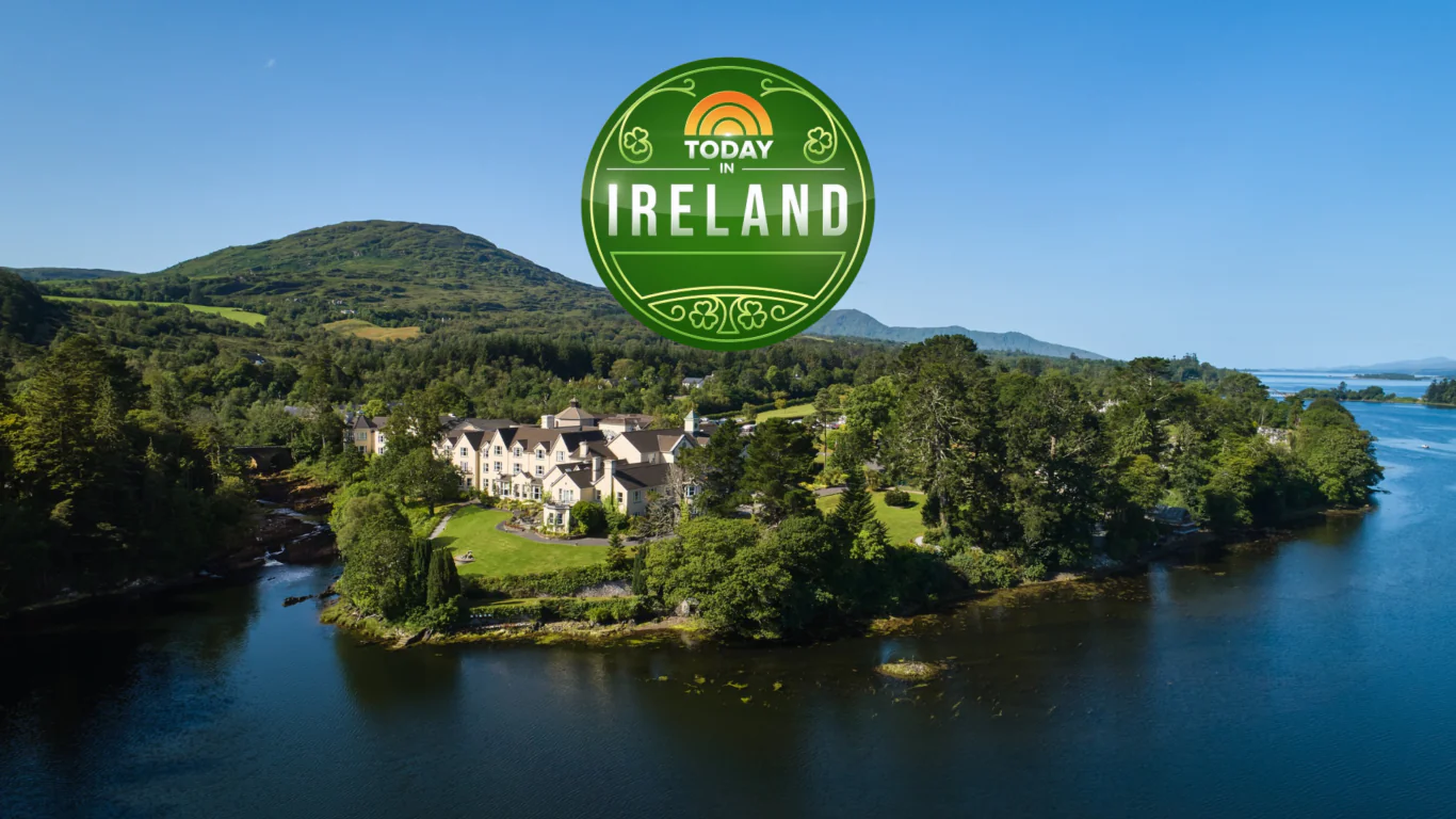 Luxurious Irish hotel on picturesque lakeside with lush green landscape and serene water views, ideal for a relaxing retreat.
